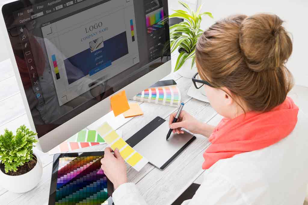 Services 5 Graphic Multimedia and Web Designer Working on design services.